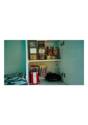 a room with a shelf with food on it at HUZURLU BİR TATİl - CARAVAN SERENITY in Domalı