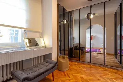 a living room with a couch and a glass wall at Bosphorus Designer Suite Seperate Guest room in Istanbul
