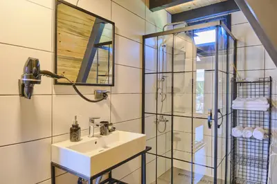 a bathroom with a sink and a glass shower at Bonte Sapanca in Feyziye
