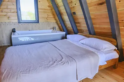 a bedroom with a bed and a bath tub at Bonte Sapanca in Feyziye