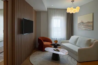 a living room with a couch and a chair at Casa Foscolo Hotel, Istanbul, a Member of Design Hotels in Istanbul