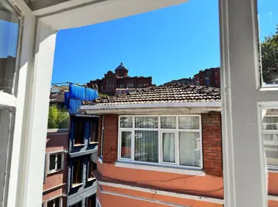a view from a window of a brick building at Yildirim's Home in Istanbul