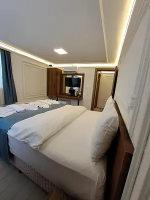 a bedroom with a large bed in a room at Tumer House Sultanahmet in Istanbul