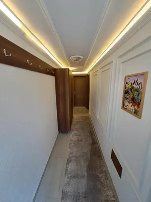 a hallway in a building with a painting on the wall at Tumer House Sultanahmet in Istanbul