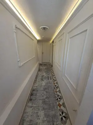 an empty hallway with a door and a tile floor at Tumer House Sultanahmet in Istanbul