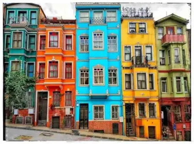 a row of colorful houses on a city street at Balat luxury House With Sea View in Istanbul