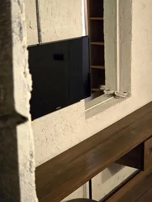 a flat screen tv on a wall next to a window at Balat luxury House With Sea View in Istanbul