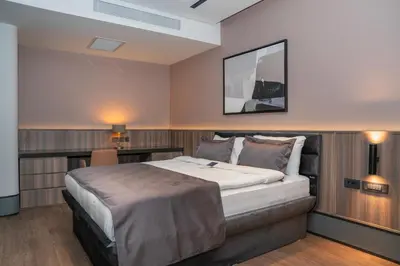 a bedroom with a large bed in a room at Romatem Move İstanbul Disabled Hotel in Istanbul