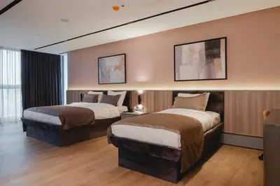 a hotel room with two beds in a room at Romatem Move İstanbul Disabled Hotel in Istanbul