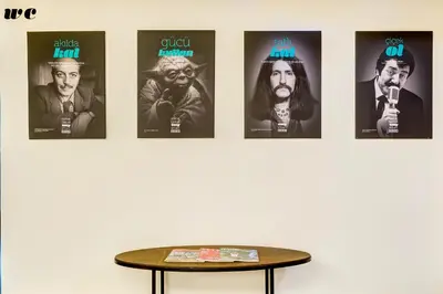 a room with four posters on a wall with a table at Plus Hotel Bostanci Atasehir in Istanbul