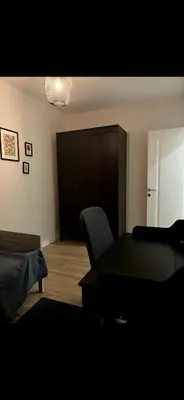 a living room with a table and a chair at KÖYLÜM RESİDENCE-2 Bostancı in Istanbul
