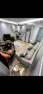 a living room with a couch and a table at KÖYLÜM RESİDENCE-2 Bostancı in Istanbul