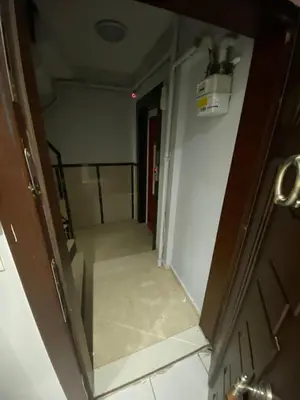 an empty hallway with a door and a room at İsra home 2 in Istanbul