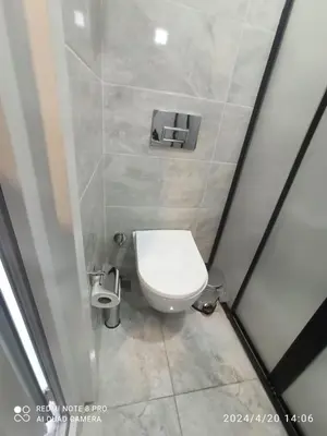 a bathroom with a white toilet in a stall at Özdemir Apart - Sultanahmet in Istanbul