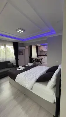 a bedroom with a large bed with blue lighting at Özdemir Apart - Sultanahmet in Istanbul