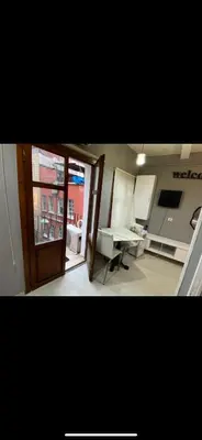 a view of a room with a table and a window at Cosy studio apartment in Istiklal central in Istanbul