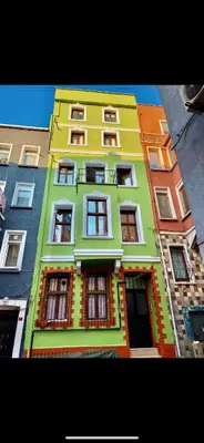 a tall multicolored building with many windows at Cosy studio apartment in Istiklal central in Istanbul