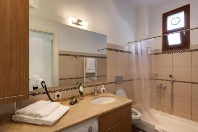 a bathroom with a sink and a shower and a toilet at Bomonti Residence charming flat in Istanbul