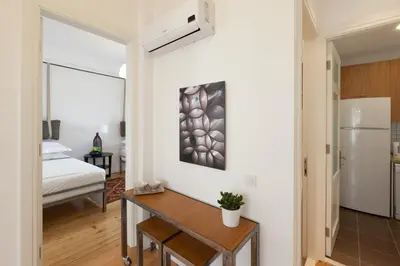 a small apartment with a kitchen and a bedroom at Bomonti Residence charming flat in Istanbul