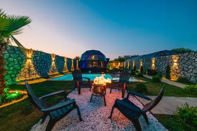 a backyard with chairs and a table and a pool at BALİ Sapanca in Sakarya