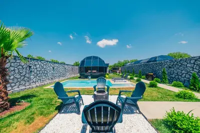 a group of chairs sitting in front of a pool at BALİ Sapanca in Sakarya