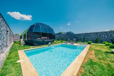 a villa with a swimming pool and a building at BALİ Sapanca in Sakarya
