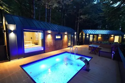 a tiny house with a swimming pool on a deck at Saklı Vadi Tiny House in Masukiye