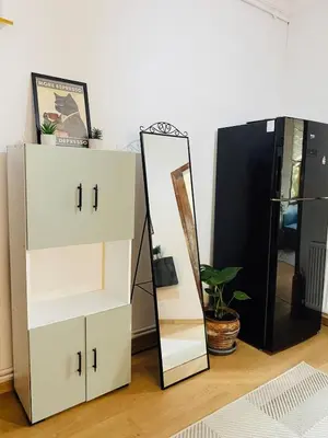 a white dresser and a mirror next to a dresser at Stylish & Comfort Apartment in Ortaköy in Istanbul