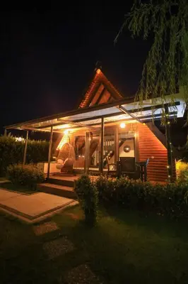 a house with a porch at night at Resort Mola Sapanca in Sapanca