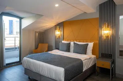 a hotel room with a large bed and a window at Icon Hotel Bomonti in Istanbul