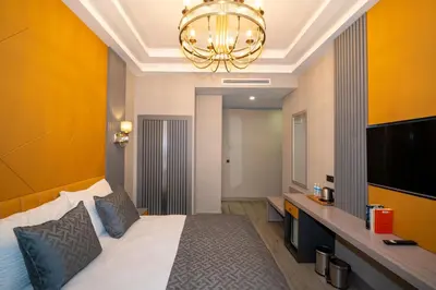 a hotel room with a bed and a television at Icon Hotel Bomonti in Istanbul