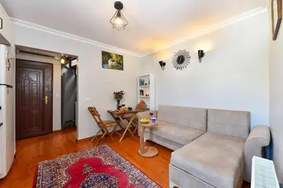a living room with a couch and a table at Taksim Private Terrace Close to Antique Store Galata Port Cihangir in Istanbul