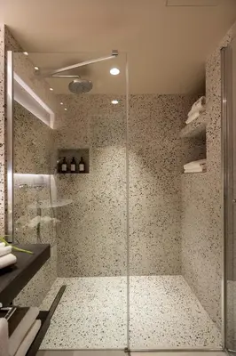 a shower with a glass door in a bathroom at ERK Hotel in Istanbul