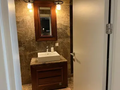 a bathroom with a sink and a mirror at huzurlu ve şirin in Istanbul