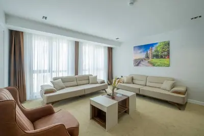 a living room with two couches and a coffee table at Euphrates Hotel Bursa in İhsaniye