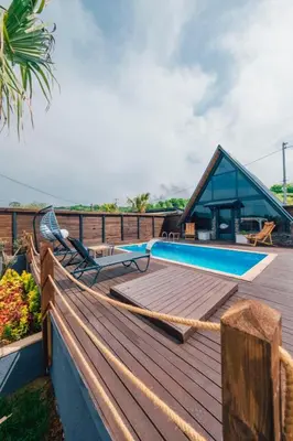 a deck with a swimming pool and a house at Club Armada Bungalow Hotel Sapanca in Sapanca