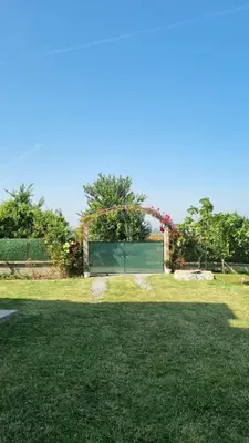 a field of grass with a fence in the background at Close to IST Airport, Sea view& peaceful apartment in Arnavutköy
