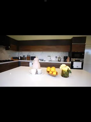 a kitchen counter with a bowl of fruit and a teapot at Blue Resort in Ovaakçaköy
