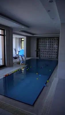 a swimming pool with many balls on the floor at Blue Resort in Ovaakçaköy