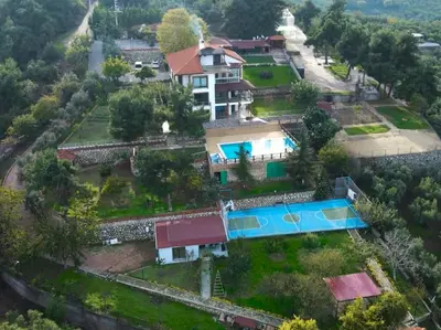 an aerial view of a house with a swimming pool at Blue Resort in Ovaakçaköy