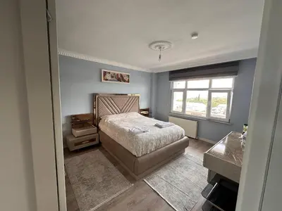 a bedroom with a bed and a window at ALTAY Airport SUİT in Tayakadın