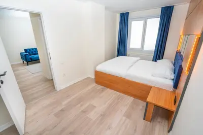 a small bedroom with a bed and a window at Guest Suites in Istanbul