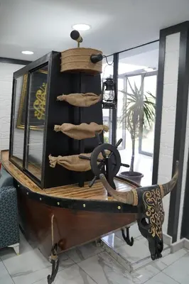 a wooden boat on display in a room at Sword Suit Hotel in Istanbul