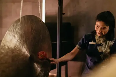 a woman standing next to a large metal object at The St. Regis Istanbul in Istanbul