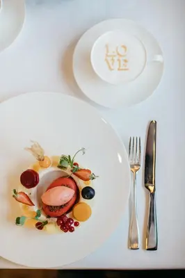 a plate of food on a table with a fork and knife at The St. Regis Istanbul in Istanbul