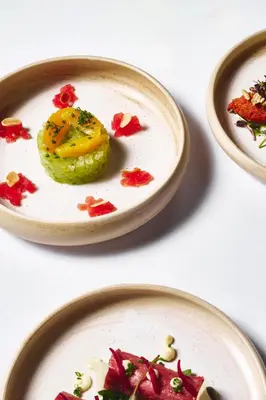 three plates of food on a white table at The St. Regis Istanbul in Istanbul