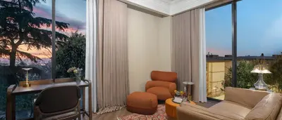 a living room with a couch and a chair at Komana Hotel Binbirdirek in Istanbul