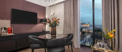 a dining room with a table and chairs and a window at Komana Hotel Binbirdirek in Istanbul
