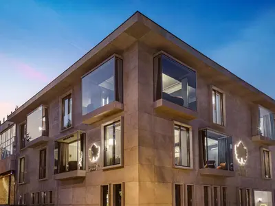 a building with large windows on the side of it at Komana Hotel Binbirdirek in Istanbul