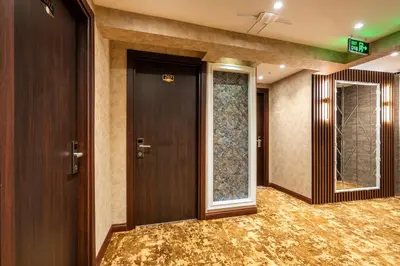 a hallway with a door and two windows at Old Harbour Hotel istanbul in Istanbul